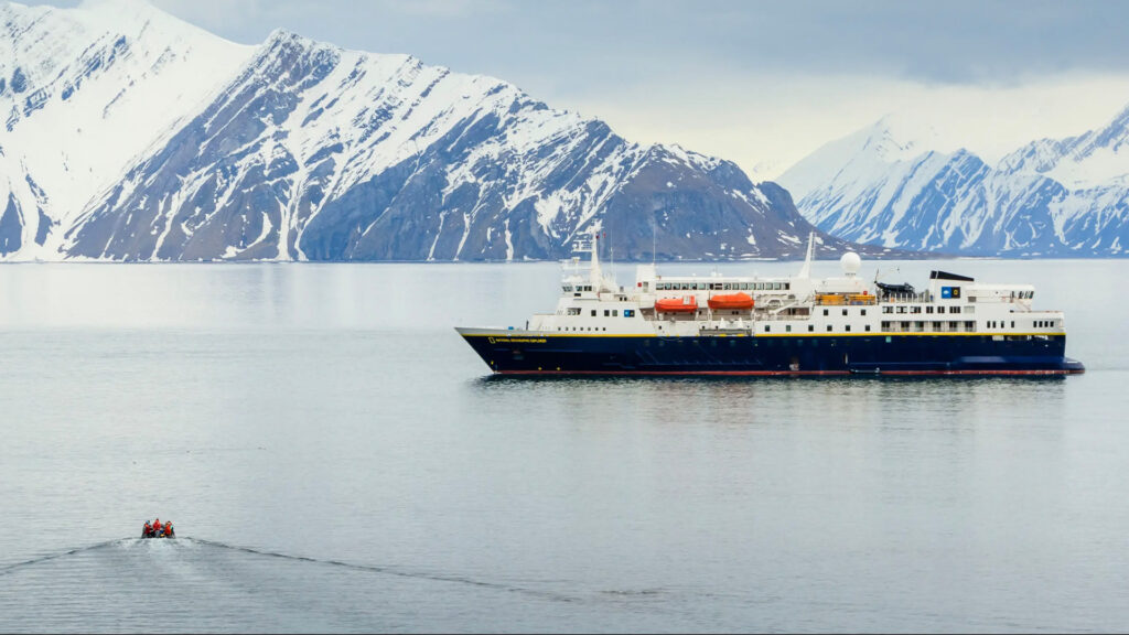 National Geographic Explorer expedition ship in a calm Antarctic bay