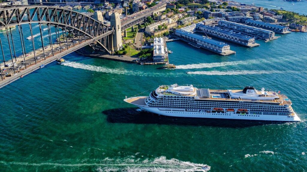 Viking cruise ship sailing past the Sydney Harbour Bridge