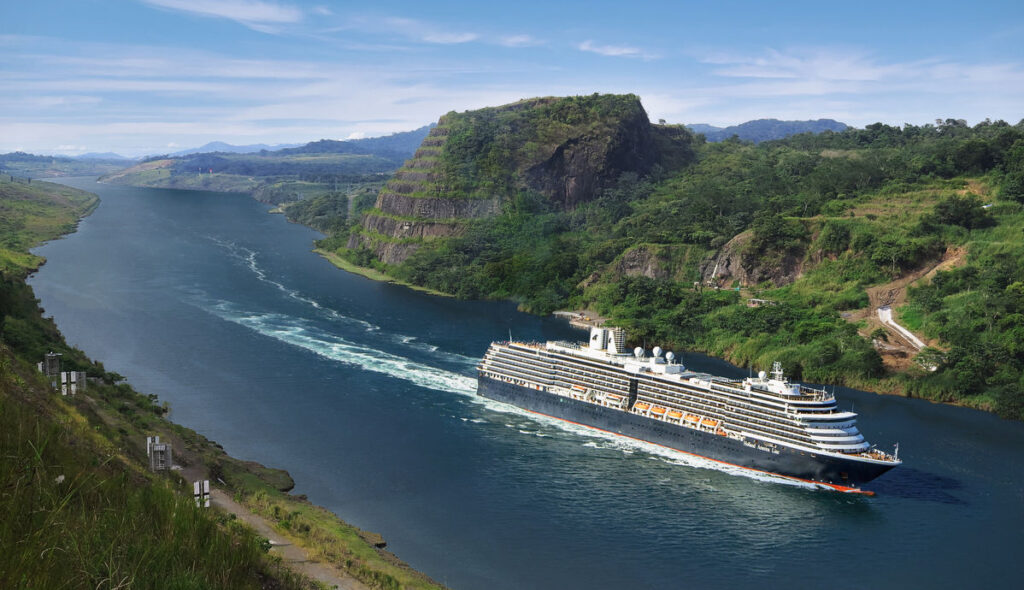 Cruise ship sailing through a narrow channel of the Panama Canal